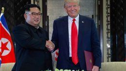 President Donald Trump and Kim Jong Un shake hands at the Singapore Summit.