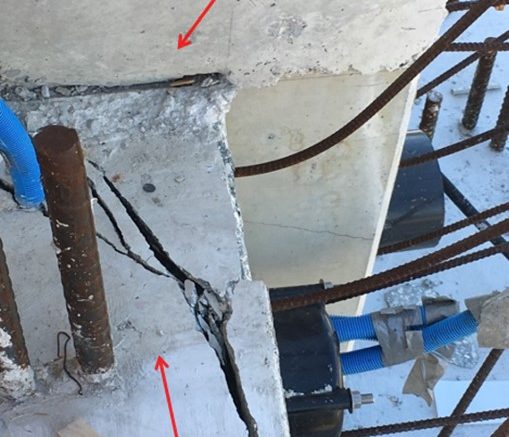 This photo illustrates the condition of the cracks after the move of the main span that occurred on March 10, 2018. Photo taken on March 14, 2018 at 1:50 pm shows east side directly adjacent to vertical member 12, top of deck looking down, view of crack. Labels added to photo by the NTSB. Photo courtesy of NTSB.
