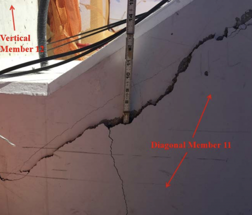 Figure 1. Location: Diaphragm II, west side directly adjacent to vertical member 12, top deck view of crack, looking to the north. Time stamp: March 13, 2018, at 11:16:50 a.m., labels added by the NTSB. Photo courtesy of NTSB.